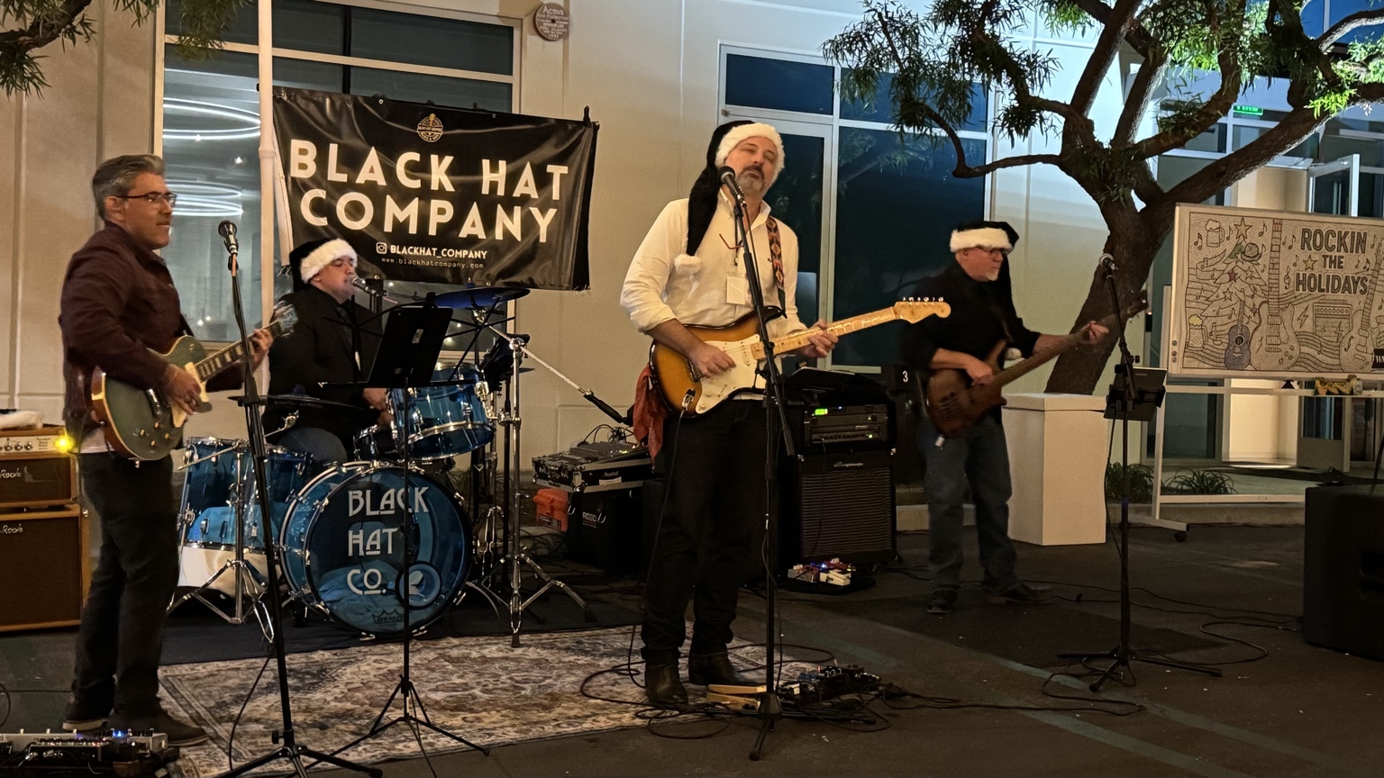 Black Hat Company performing an outdoor evening set